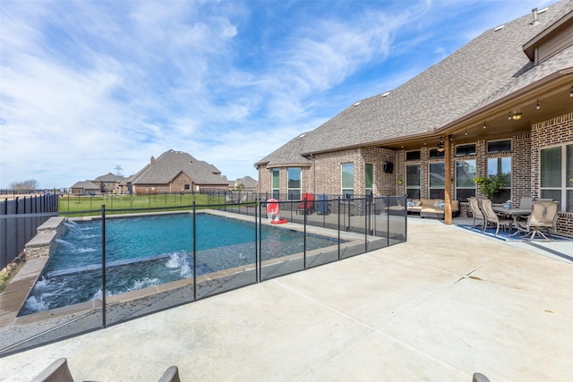 view of swimming pool with a patio area, a fenced backyard, and a fenced in pool