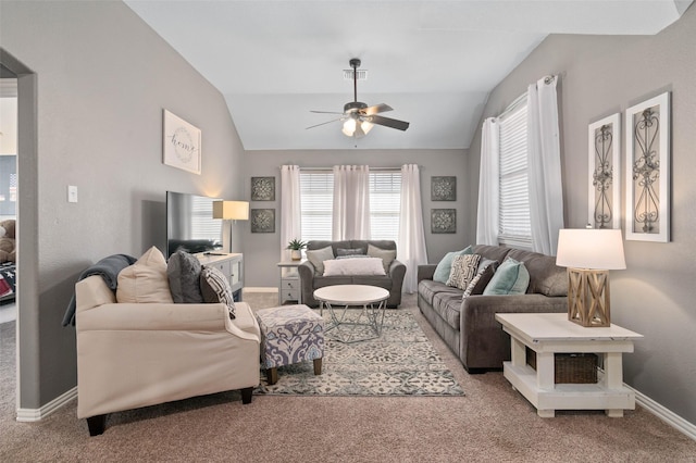 carpeted living room featuring visible vents, vaulted ceiling, baseboards, and ceiling fan