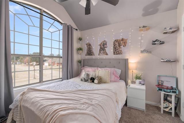 carpeted bedroom featuring lofted ceiling and ceiling fan