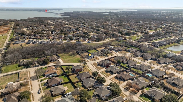 bird's eye view featuring a water view and a residential view