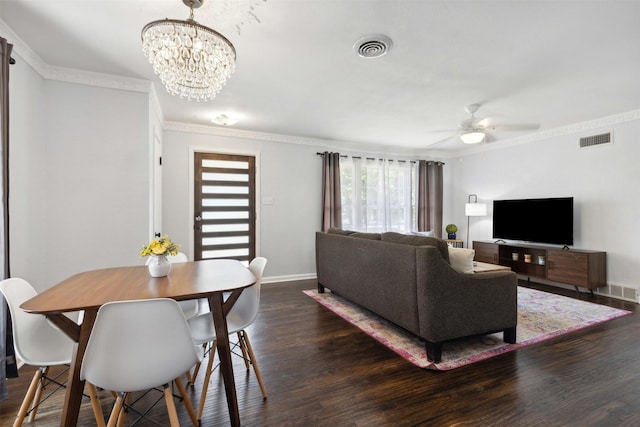 dining area with wood finished floors, visible vents, and crown molding