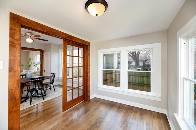 entryway with french doors, hardwood / wood-style floors, and baseboards