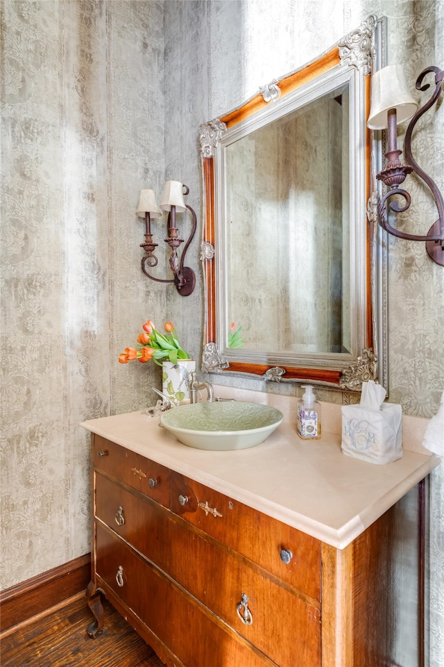 bathroom featuring vanity and wood finished floors