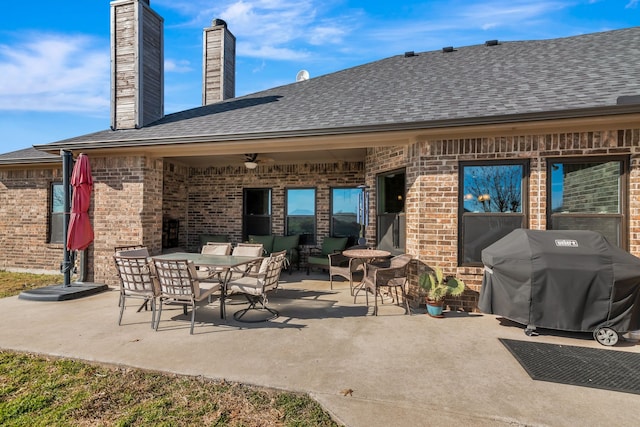 view of patio / terrace with outdoor dining space and grilling area