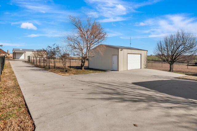 exterior space with concrete driveway