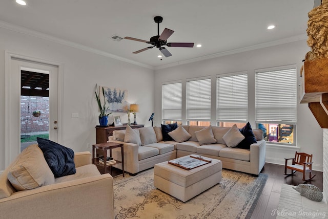 living room featuring light wood-style floors, recessed lighting, visible vents, and crown molding