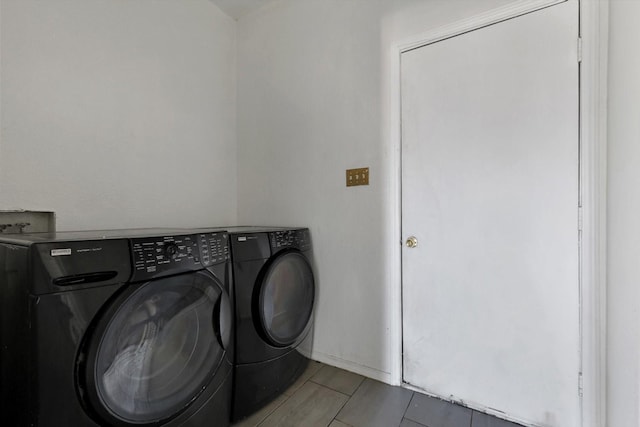 clothes washing area with laundry area and washing machine and clothes dryer