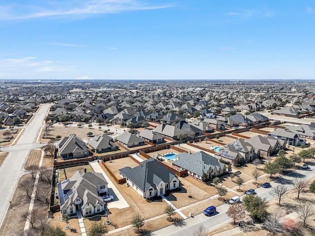 birds eye view of property with a residential view