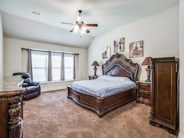 bedroom with carpet flooring, a ceiling fan, visible vents, vaulted ceiling, and baseboards