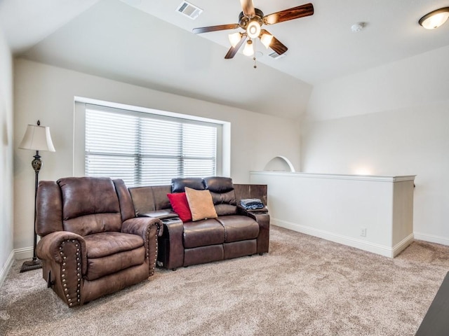 living area with ceiling fan, visible vents, baseboards, vaulted ceiling, and carpet