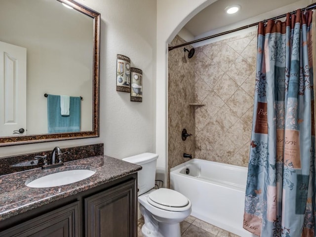 bathroom with shower / tub combo, tile patterned flooring, vanity, and toilet