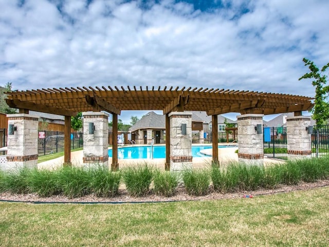 pool featuring fence and a pergola