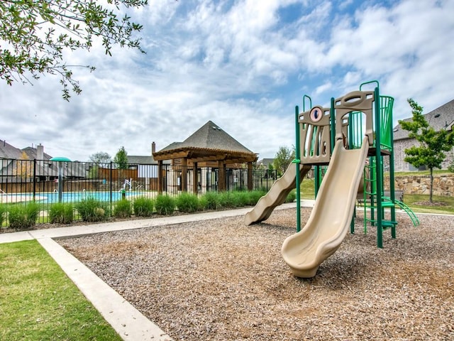 communal playground featuring fence