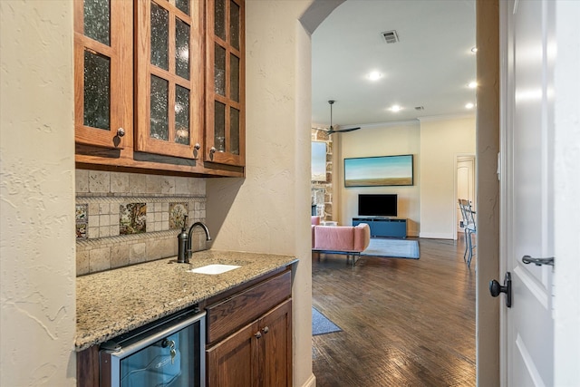 885 Vz County Road 2513, Canton, TX 75103 - bar area with a sink, backsplash, ornamental molding, a ceiling fan, and arched walkways