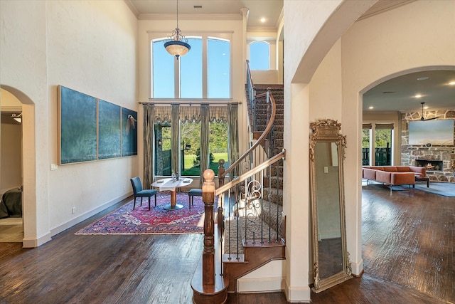 885 Vz County Road 2513, Canton, TX 75103 - foyer entrance featuring wood finished floors, stairs, a towering ceiling, baseboards, and a fireplace