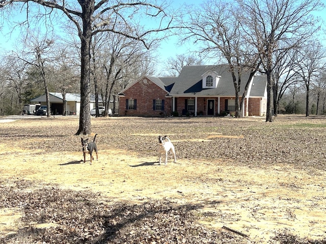 view of front of home featuring brick siding