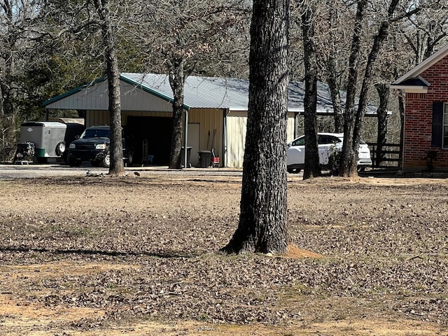 view of outdoor structure featuring an attached carport