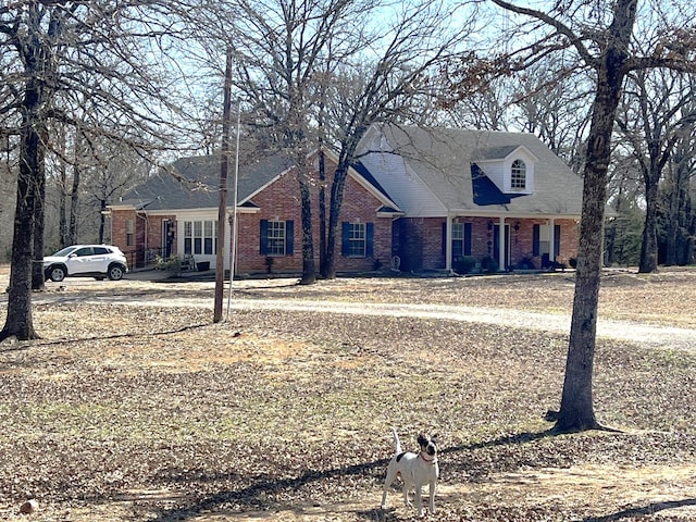 view of front of home with brick siding