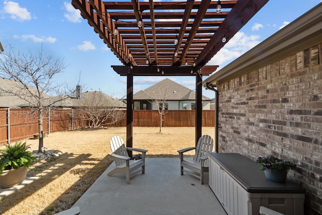 view of patio / terrace with a fenced backyard and a pergola