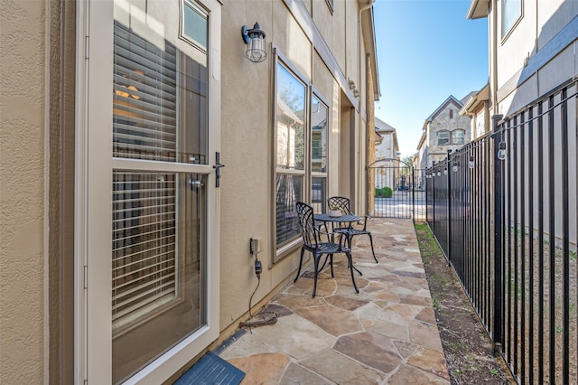 balcony with a residential view and a patio area