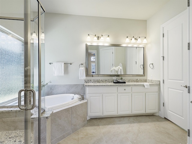 bathroom featuring a stall shower, a garden tub, and a wealth of natural light