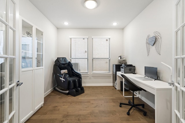 office area featuring french doors, a healthy amount of sunlight, baseboards, and wood finished floors