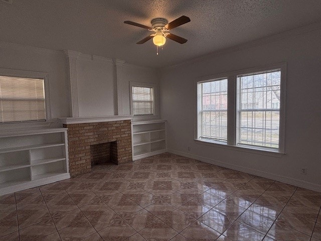 unfurnished living room with a textured ceiling, a fireplace, a wealth of natural light, and baseboards