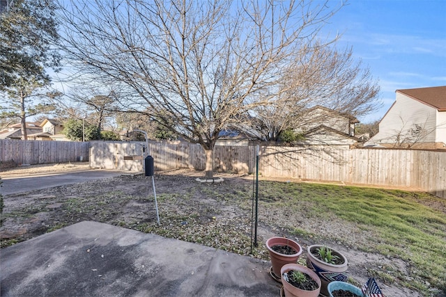 view of yard featuring a patio area and a fenced backyard