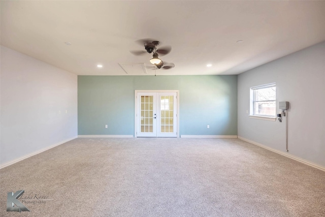 unfurnished room featuring recessed lighting, french doors, attic access, and baseboards