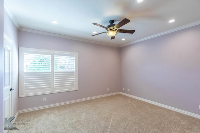 empty room with light carpet, baseboards, crown molding, and ceiling fan