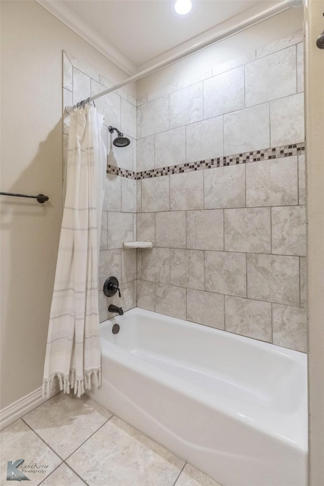 full bathroom featuring baseboards, shower / tub combo with curtain, ornamental molding, and tile patterned flooring