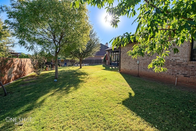 view of yard with a fenced backyard