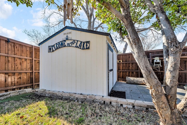 view of shed with a fenced backyard