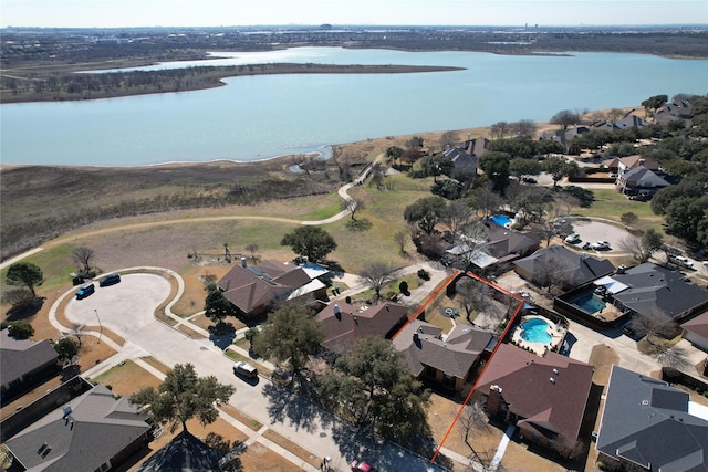 aerial view with a water view and a residential view