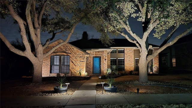 view of front of house featuring brick siding