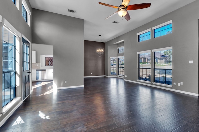 unfurnished living room featuring wood finished floors and visible vents