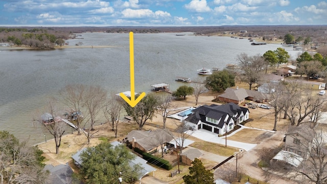 birds eye view of property featuring a water view