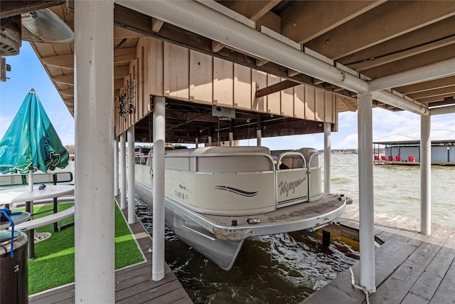 view of dock with a water view and boat lift