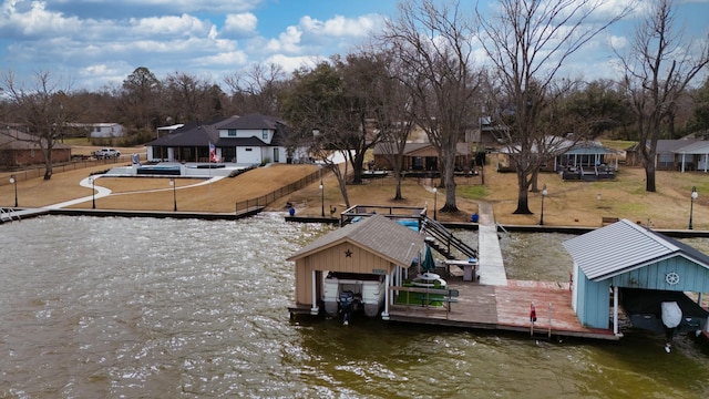 dock area featuring a residential view and a water view