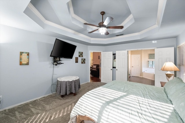 carpeted bedroom with ceiling fan, ornamental molding, a raised ceiling, and visible vents