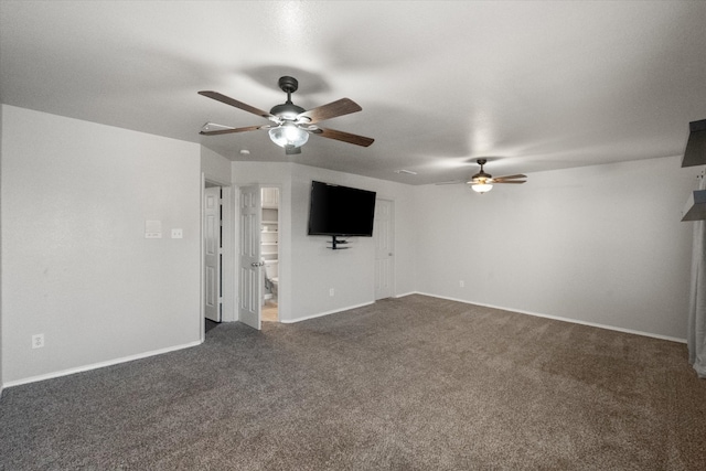 unfurnished living room featuring dark colored carpet, ceiling fan, and baseboards