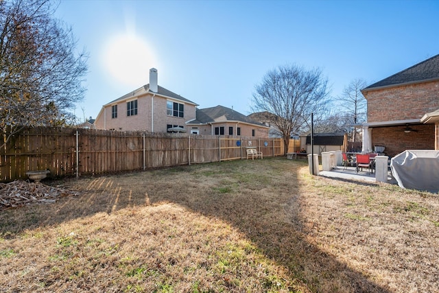 view of yard featuring a fenced backyard and a patio