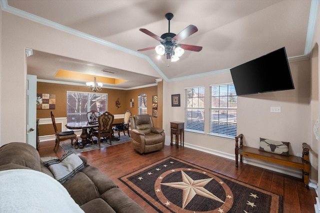 living room with ceiling fan with notable chandelier, visible vents, baseboards, hardwood / wood-style floors, and crown molding