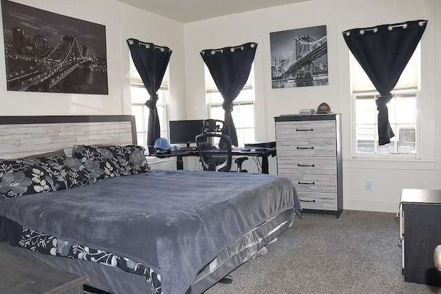 carpeted bedroom featuring baseboards