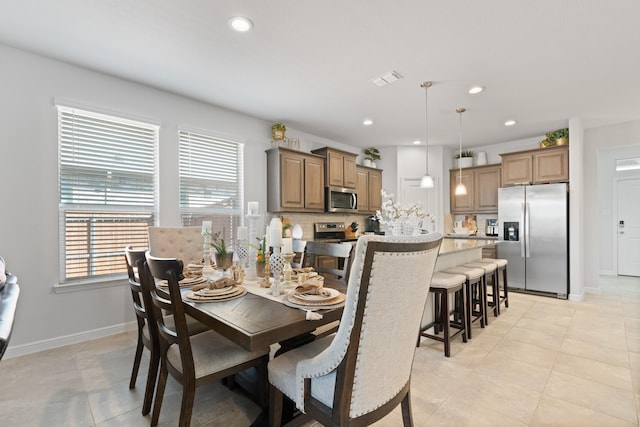 dining area featuring baseboards, light tile patterned flooring, visible vents, and recessed lighting