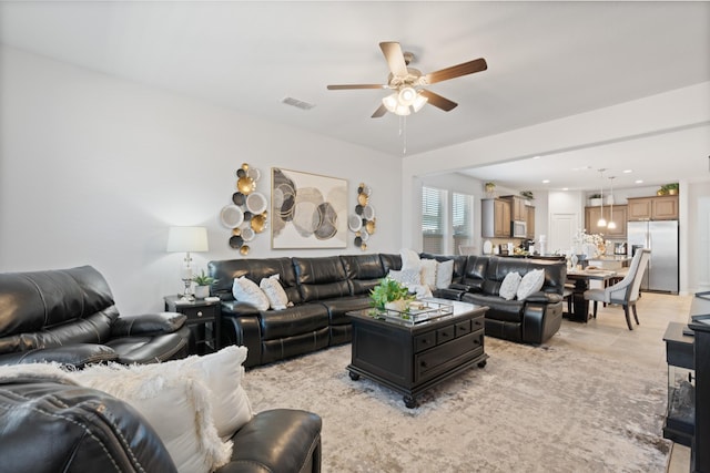 living area featuring light tile patterned floors, visible vents, a ceiling fan, and recessed lighting