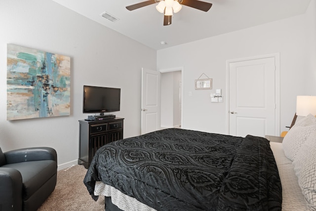 carpeted bedroom with ceiling fan and visible vents