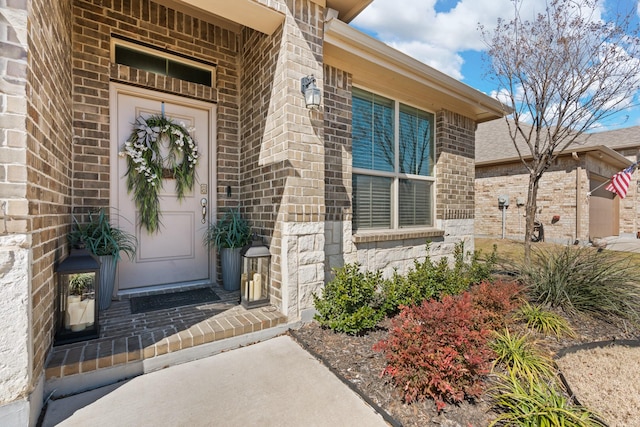 entrance to property with brick siding