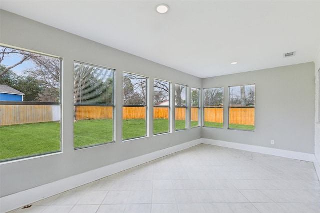 unfurnished sunroom with visible vents