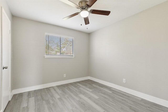 empty room featuring a ceiling fan, light wood-style flooring, and baseboards